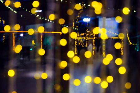 Selective focus. A garland of light bulbs on the window.