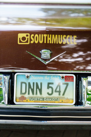 license plate. part of Retro Cadillac car at the exhibition of vintage cars.のeditorial素材