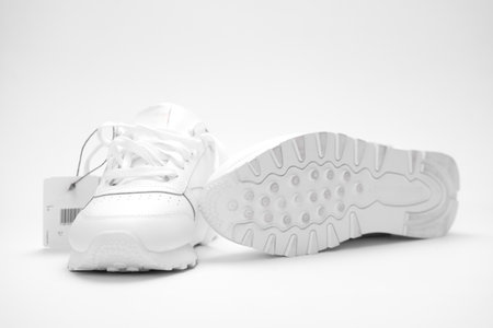 New white sneakers on a white background.の写真素材