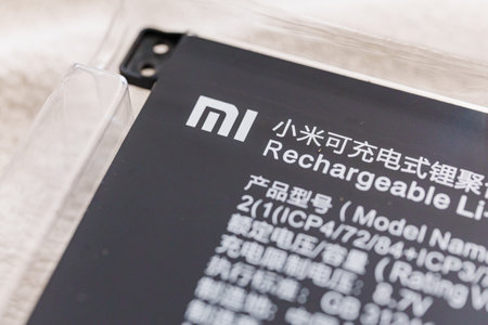 part of A new battery to replace the old one in a broken laptopのeditorial素材