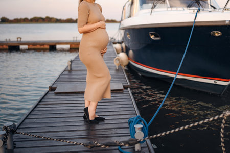 A pregnant woman on the pier.の写真素材