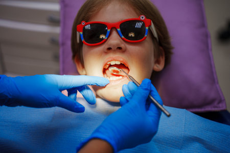 Teenage girl at the dentists appointment. regular hygiene.の写真素材