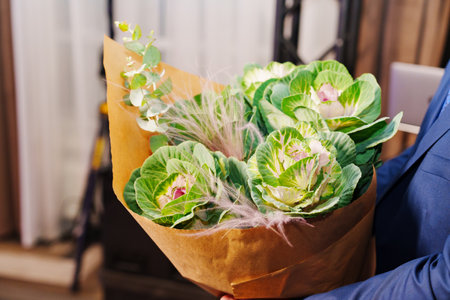 Bouquet of cauliflower flowers in kraft paper.の写真素材