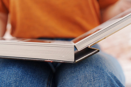 flipping through a photo book with wedding photos