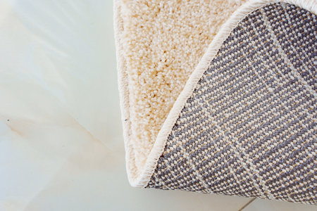 close-up beige Interior pile carpet made of polypropylene. Long fibers form a high pile. pleasant...