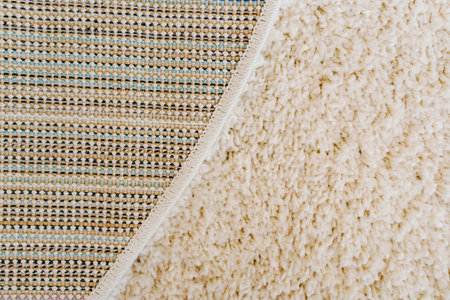 close-up beige Interior pile carpet made of polypropylene. Long fibers form a high pile. pleasant...