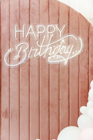 Happy Birthday inscription made of LED strip on a velvet soft surface. decoration for the holiday.の写真素材