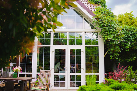 The yard in the house is with panoramic glazing.