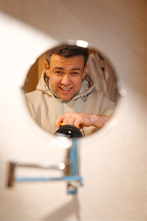 Lamp and round mirror in the bathroom in the tent house in the glamping. A solution for the interior of a campsite.の写真素材