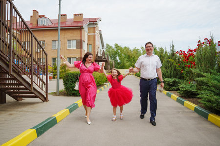 Happy well-dressed family on a walk.の写真素材