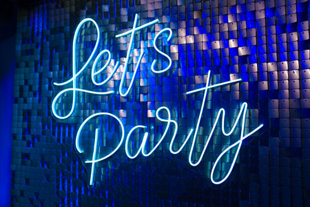 Let's party inscription on the glitter wall. Holiday decor. background.の写真素材