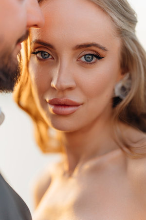 close-up. Gentle and happy bride and groom at sunset. Romantic.の写真素材