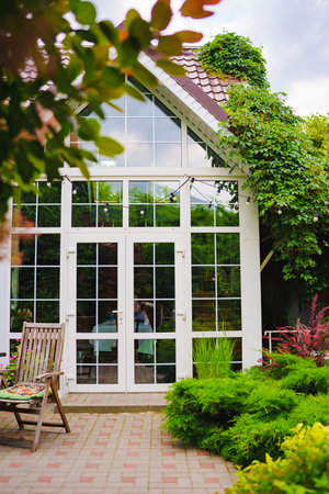 The yard in the house is with panoramic glazing.