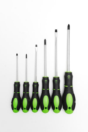 Screwdriver set 10 pieces on a white background. Hand-held locksmith and joiner's mounting tools for screwing and unscrewing threaded fasteners.の写真素材
