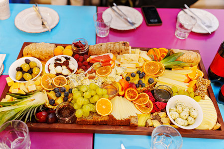 A large fruit platter with exotic berries and fruits. Fruit delivery for a buffet table.の写真素材