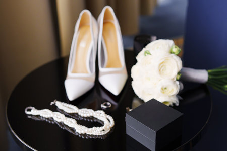 Traditional accessories of the bride and groom for the wedding day. necklace, rings, bouquet,...