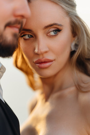 close-up. Gentle and happy bride and groom at sunset. Romantic.の写真素材