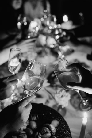 Celebration with toasting glasses on festive tableの写真素材