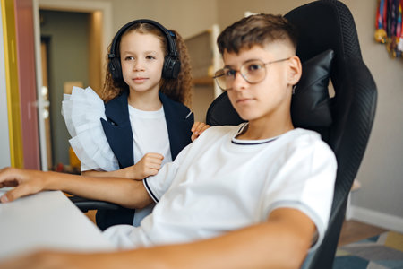 Sibling bond during gaming session at home in cozy room