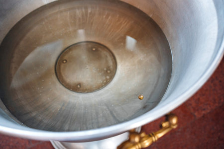 Water reflection in a silver bowl at an outdoor location