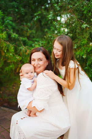 Family bonding moment in a garden with kids