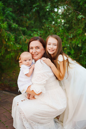 Family moment in nature with mother and children