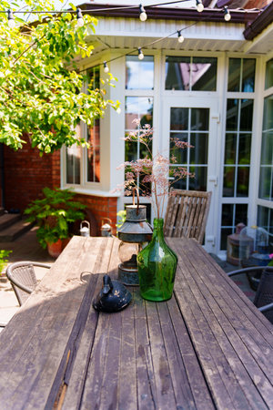 Outdoor table with decorations and plants during the dayの写真素材