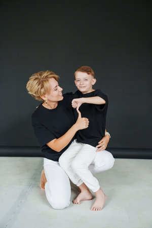 Mother and son share a moment of fun indoors during their photoshootの写真素材