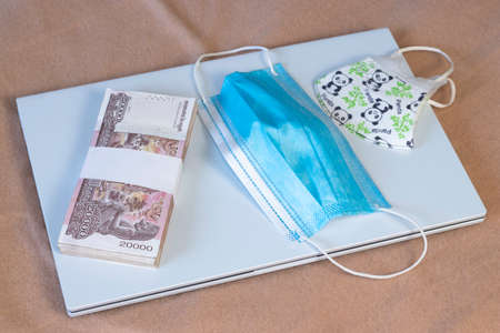 Pack of 20000 Cambodia Real bills and mask for healthcareの写真素材