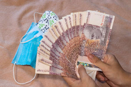 20000 Cambodia Real bills and medical mask. Healthcare and medical conceptの写真素材