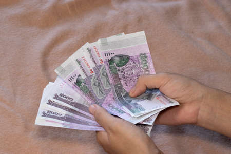 5000 Cambodia Real bills and hand counting moneyの写真素材