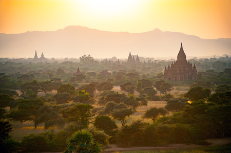 Scenic beautiful sun set  ancient pagoda field