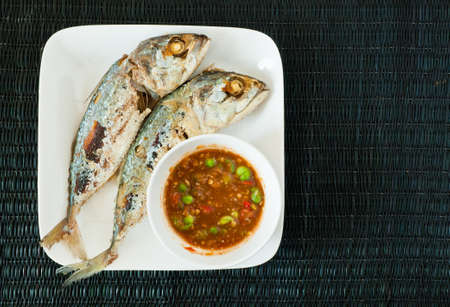 Creative food of Fried Mackerel fish,chili sauceの写真素材