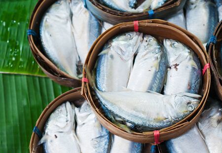 Mackerel fish in bamboo basket at market, Thailand