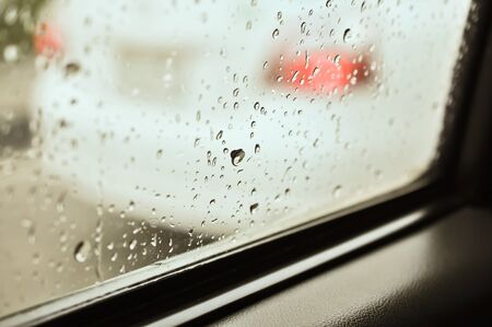 Close up of water drops after rain at the car windowの写真素材