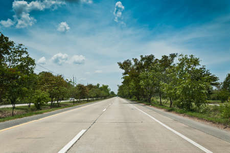 Road and cloudy sky landscape of Thailandの写真素材