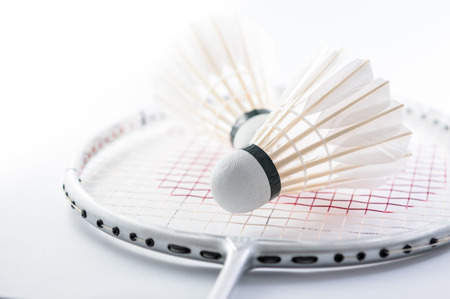 Shuttlecock on badminton racket closeupの写真素材