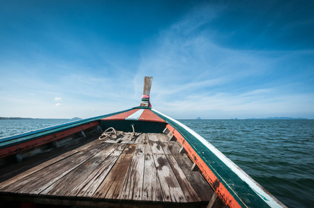 driving a wooden boat in the sea, freedom conceptionの写真素材