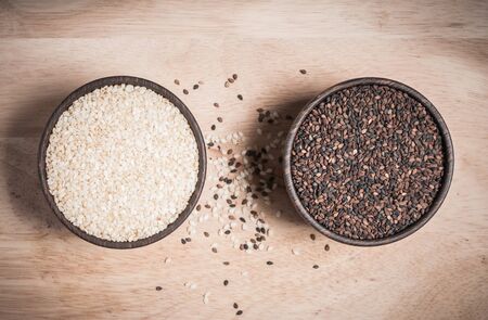 sesame and poppy in wood bowl closeup