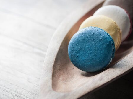macaron on wood bowlの写真素材