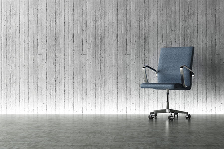 Office chair and concrete wall conceptの写真素材