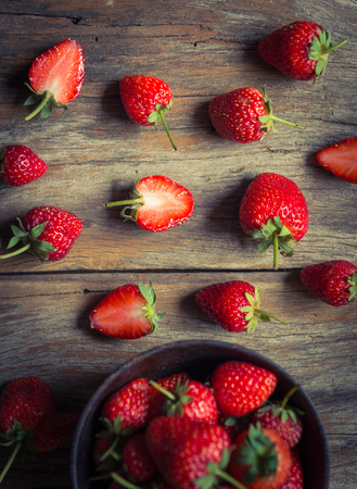 strawberry fruit on grunge wooden backgroundの写真素材