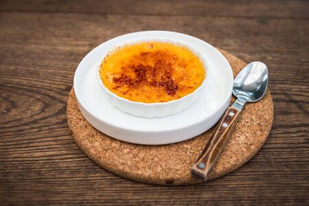 creme brulee sweet food on wooden backgroundの写真素材