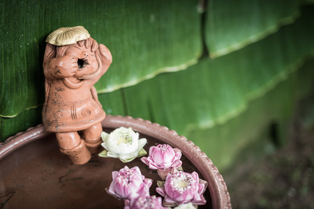 closeup of doll sculpture with poolの写真素材