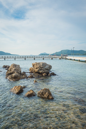 Landscape of rock in the ocean with bridgeの写真素材