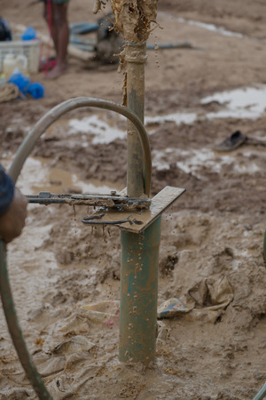 worker man making of soil punch, search for waterの写真素材