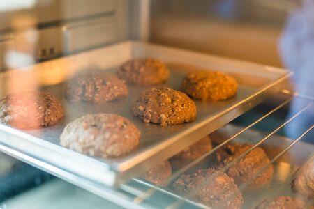 Closeup of cookie on tray in a ovenの写真素材