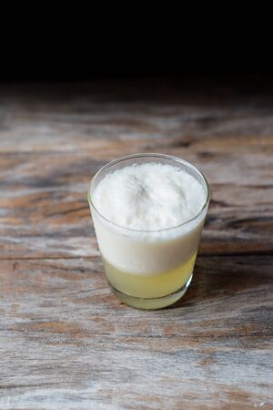 Drink of smoothie fruit on grunge woodenの写真素材