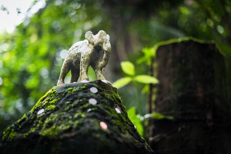 Small elephant sculpture closeup on a pillarの写真素材