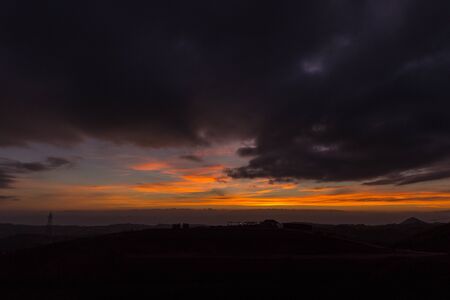 Landscape of sunrise with dark clouds sky